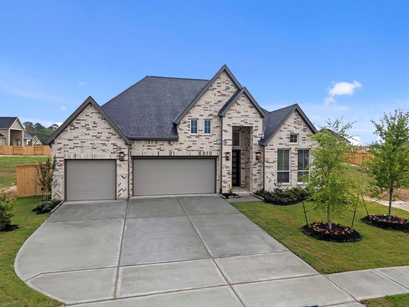 Front exterior of a new home in Briarley, Montgomery, TX, highlighting curb appeal (Image 22).