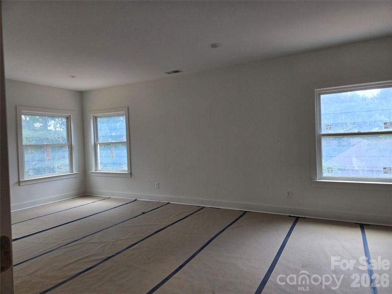 This secondary bedroom offers ample space, featuring double closets and convenient en-suite access to a full bathroom. This secondary bedroom offers ample space, featuring double closets and convenient en-suite access to a full bathroom.