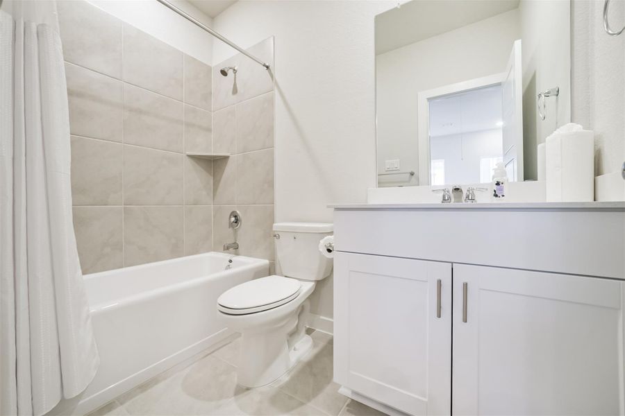 This bathroom with tub and shower combo is shared between Bedroom 2 and 3. This bathroom with tub and shower combo is shared between Bedroom 2 and 3.