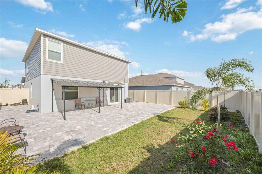 Exterior details and patio area of a home in Peace Creek Reserve: Manor Key Collection, Winter Haven (Image 36).