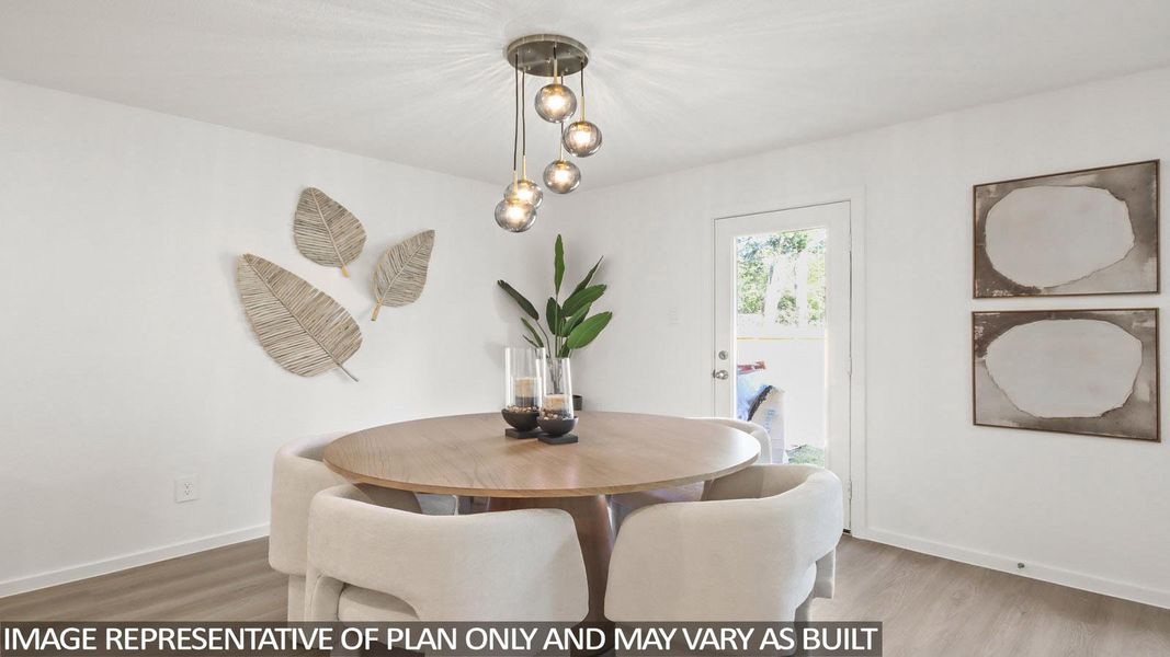 Dining space featuring baseboards and light wood-style floors