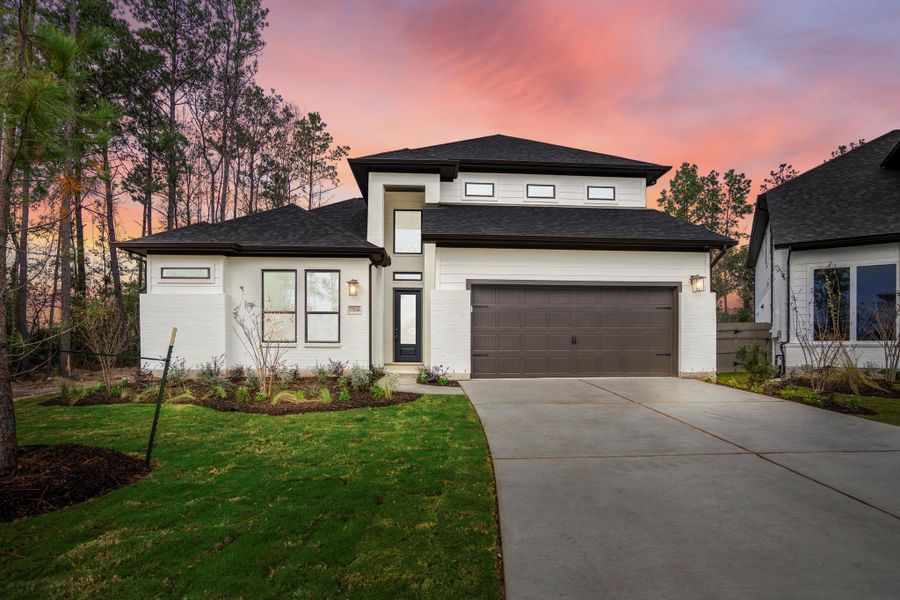 Front exterior of a new home in Artavia, Conroe, TX, highlighting curb appeal (Image 2). Front exterior of a new home in Artavia, Conroe, TX, highlighting curb appeal (Image 2).