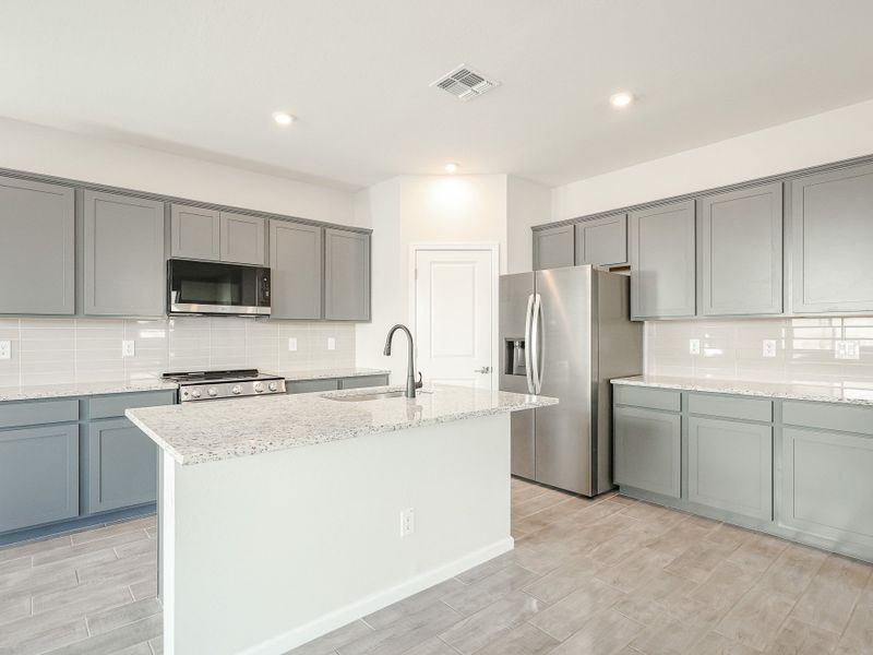 A kitchen with white cabinets. A kitchen with white cabinets.