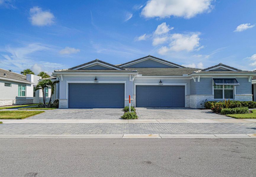 Front exterior of a new home in , Port St. Lucie, FL, highlighting curb appeal (Image 16).