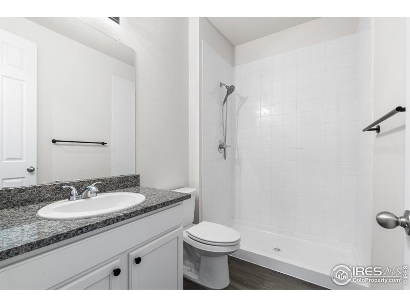 Main Level Bathroom Between Bedroom 1 and 2. 8 X 5'5.