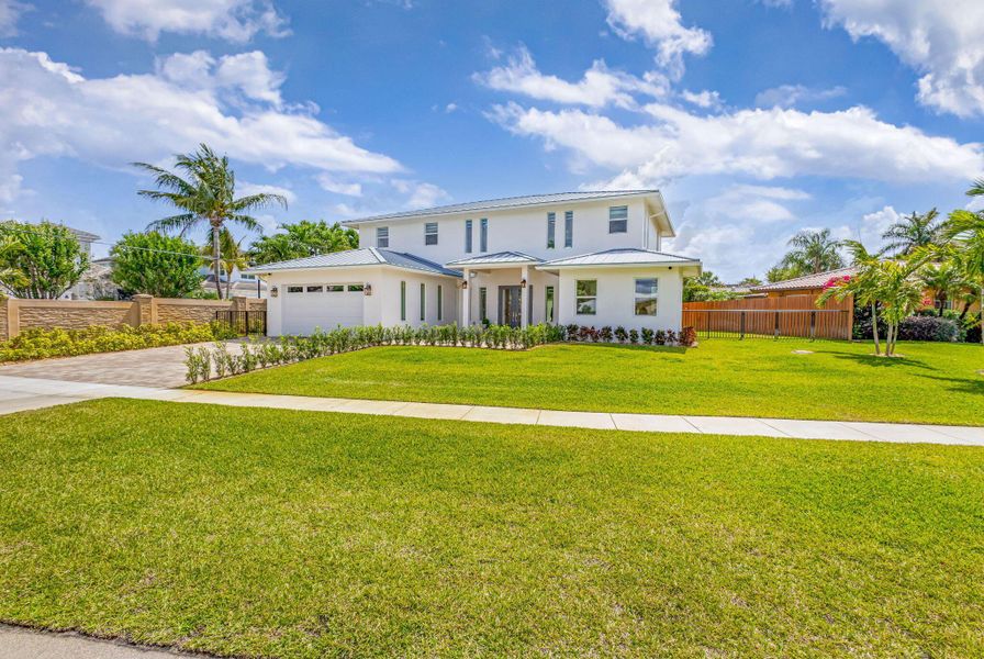 Front exterior of a new home in , North Palm Beach, FL, highlighting curb appeal (Image 37). Front exterior of a new home in , North Palm Beach, FL, highlighting curb appeal (Image 37).