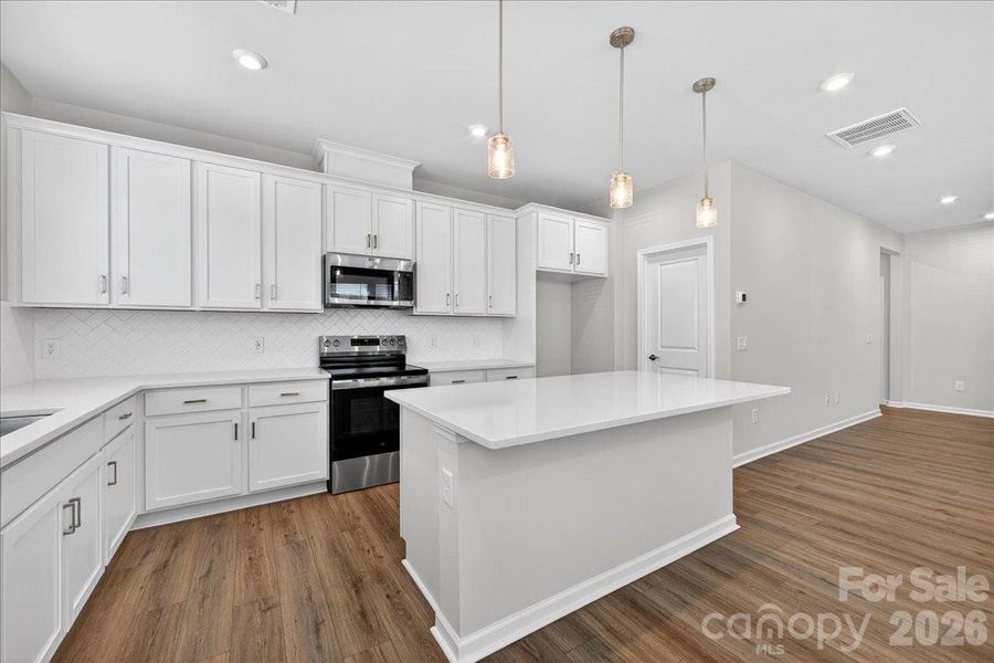 Kitchen perfectly anchors first floor for entertaining
