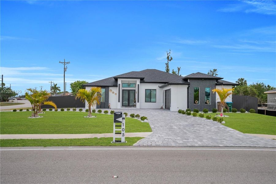 Front exterior of a new home in , Cape Coral, FL, highlighting curb appeal (Image 25).