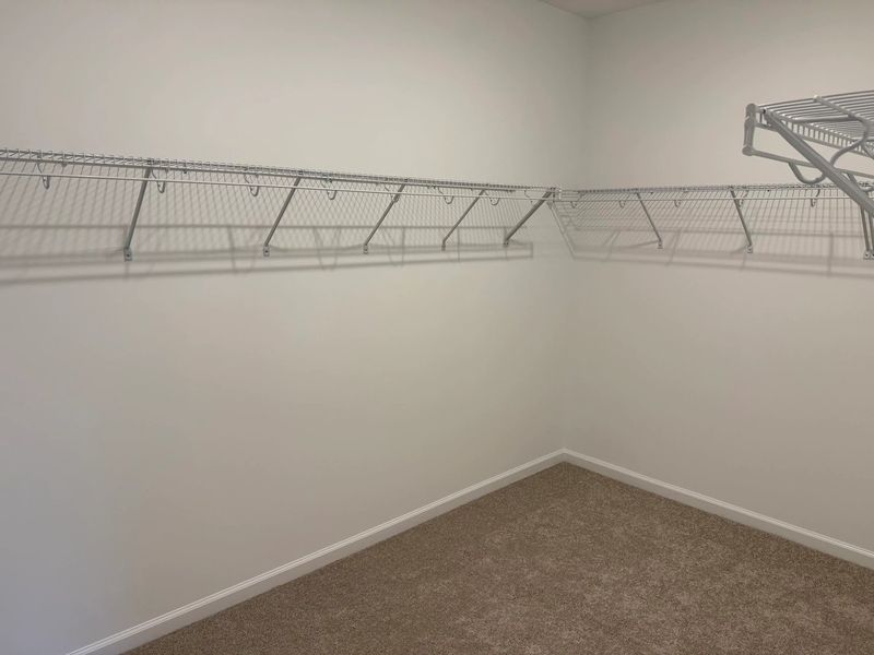 Primary Walk-In featuring the AW Collection® Artisan - Simple, spacious, and effortlessly styled. Primary Walk-In featuring the AW Collection® Artisan - Simple, spacious, and effortlessly styled.