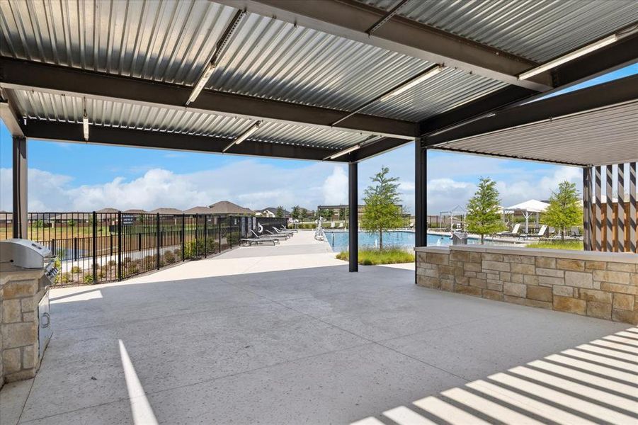 View of patio / terrace featuring a pool and a residential view View of patio / terrace featuring a pool and a residential view