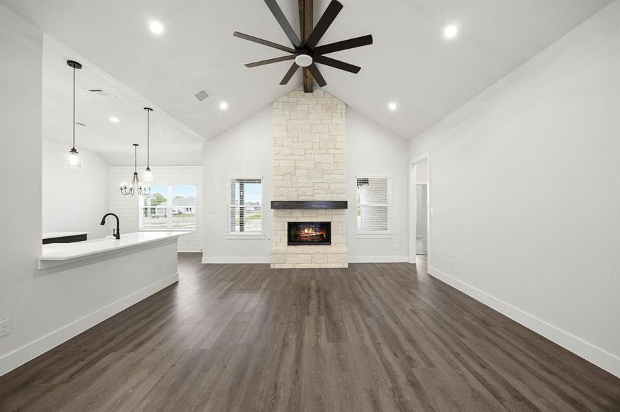 Vaulted ceiling featuring a dark wood-finish ceiling fan and recessed lighting