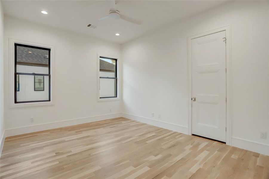 BEDROOM #3: This middle bedroom off the bedroom hall has a walk-in closet, ceiling, fan, and recessed cans.