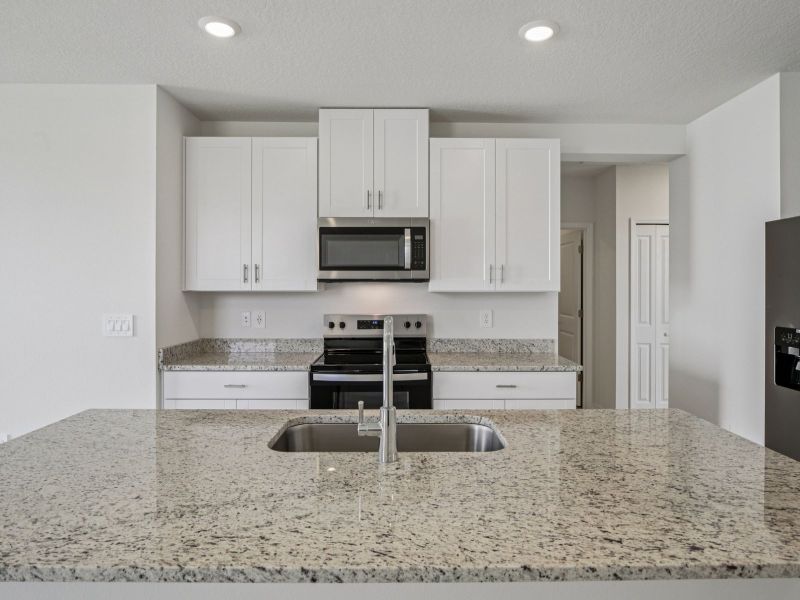 Furnished interior view inside a new home in The Grove at Stuart Crossing - Premier Series, Bartow (Image 3).