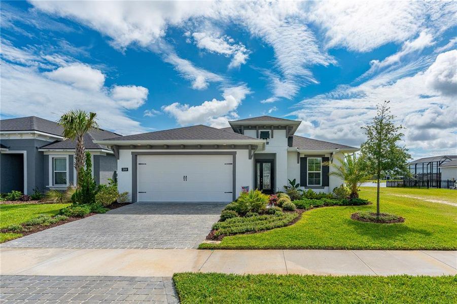 Front exterior of a new home in Mosaic, Daytona Beach, FL, highlighting curb appeal (Image 22). Front exterior of a new home in Mosaic, Daytona Beach, FL, highlighting curb appeal (Image 22).