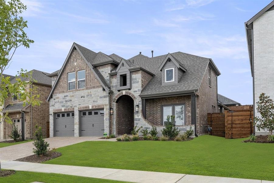 Front exterior of a new home in Solterra, Mesquite, TX, highlighting curb appeal (Image 15).