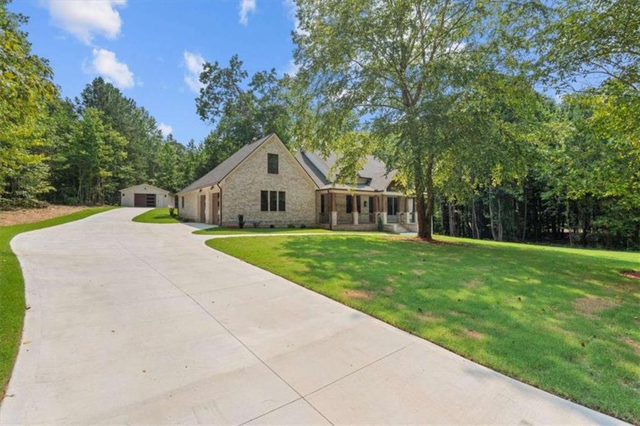 Front exterior of a new home in , Carrollton, GA, highlighting curb appeal (Image 27).