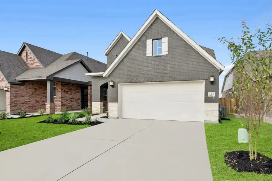 Front exterior of a new home in Mayfair - Select Garden Series, New Braunfels, TX, highlighting curb appeal (Image 2). Front exterior of a new home in Mayfair - Select Garden Series, New Braunfels, TX, highlighting curb appeal (Image 2).