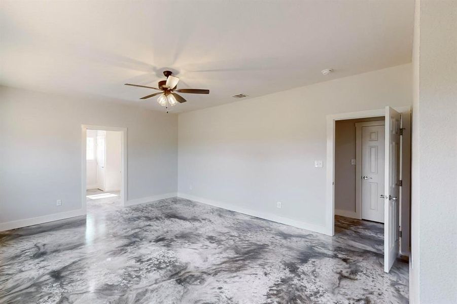 Spare room with ceiling fan