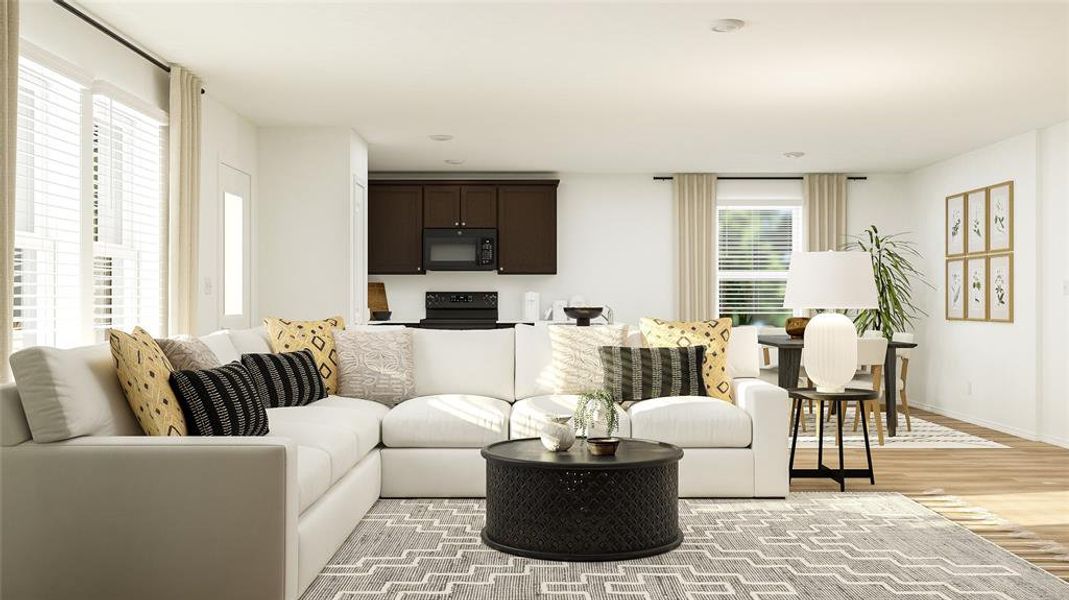 Living area featuring light wood-style flooring and baseboards Living area featuring light wood-style flooring and baseboards