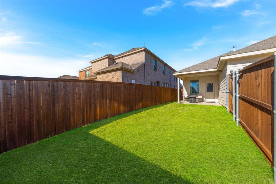 View of yard with central AC and a patio area