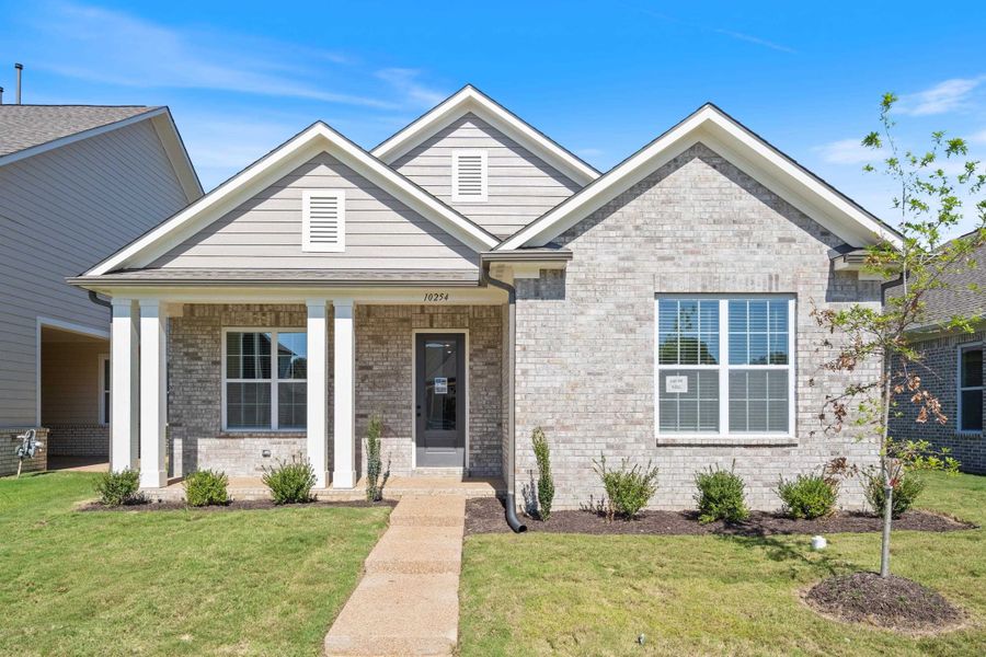 Front exterior of a new home in Lockwood, Collierville, TN, highlighting curb appeal (Image 1). Front exterior of a new home in Lockwood, Collierville, TN, highlighting curb appeal (Image 1).