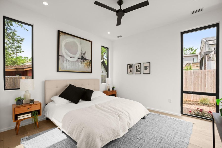 Bedroom featuring recessed lighting, light wood-type flooring, and a ceiling fan