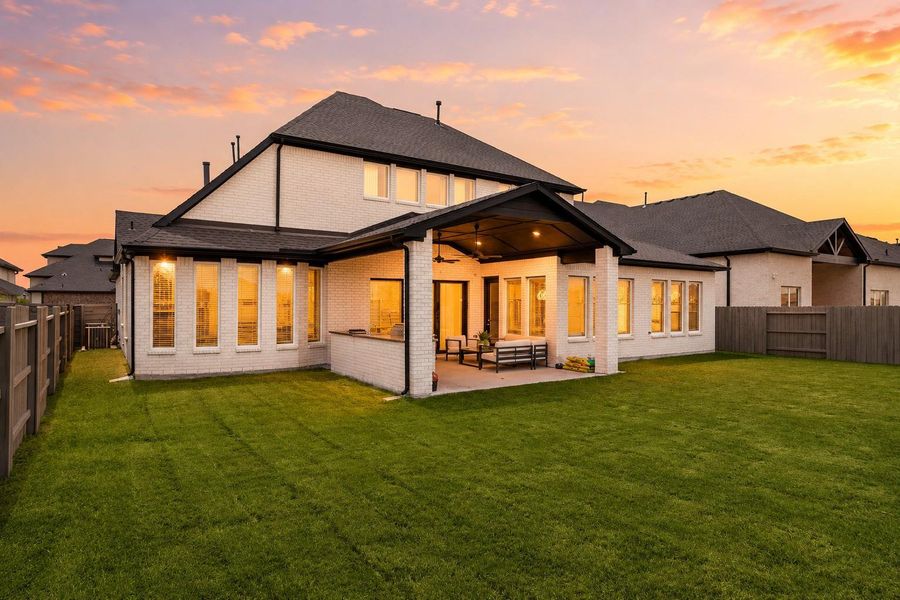 Beautiful backyard with a spacious lawn and elegant exterior presence.