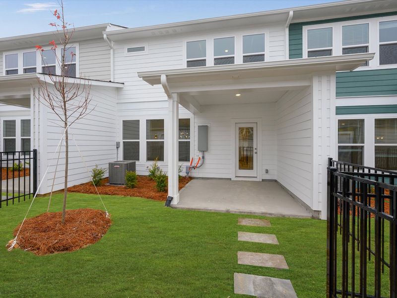 Exterior details and patio area of a home in North Creek Village - Townhomes, Huntersville (Image 4).