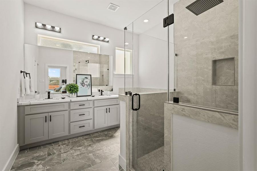 Pamper yourself in this spa-like bathroom! Luxurious fixtures, a deep soaking tub, and elegant tile work make this space a sanctuary. Treat yourself to a soothing bath after a long day