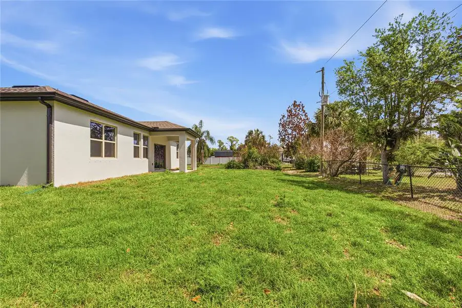 Exterior details and patio area of a home in , North Port (Image 28).