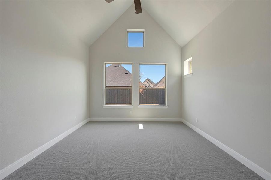 Bonus room featuring carpet floors and ceiling fan