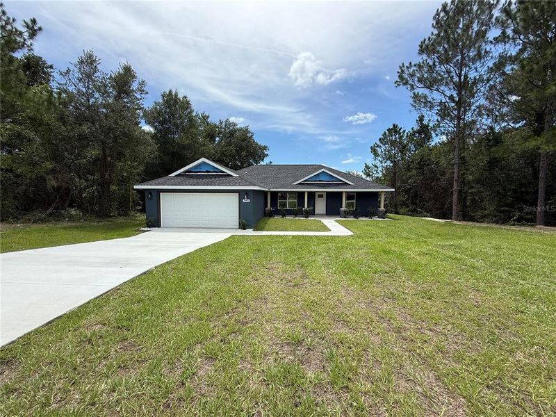 Front exterior of a new home in , Citrus Springs, FL, highlighting curb appeal (Image 19).