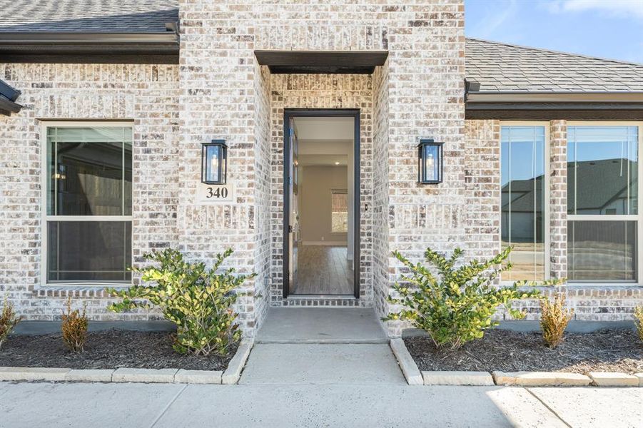 Exterior details and patio area of a home in Parks at Panchasarp Farms, Burleson (Image 3).