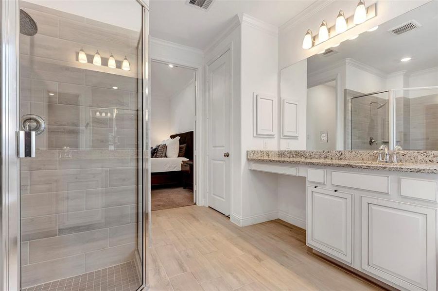 Wonderful shower in the primary bathroom. Tile floors, vanity area, linen closet and much more.