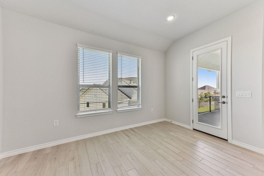 Empty room featuring light wood-type flooring, recessed lighting, and vaulted ceiling Empty room featuring light wood-type flooring, recessed lighting, and vaulted ceiling