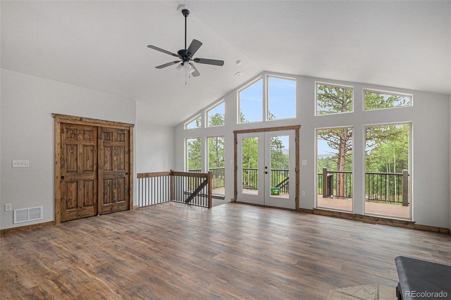 Floor to ceiling windows with access to wrap around deck and views of Lone Rock