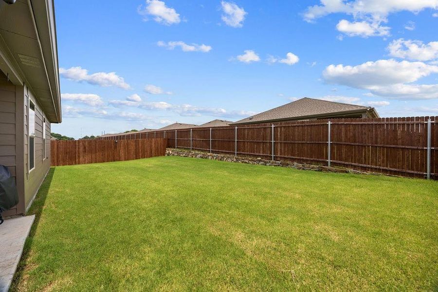 Exterior details and patio area of a home in Leonard Crossing, Leonard (Image 22).