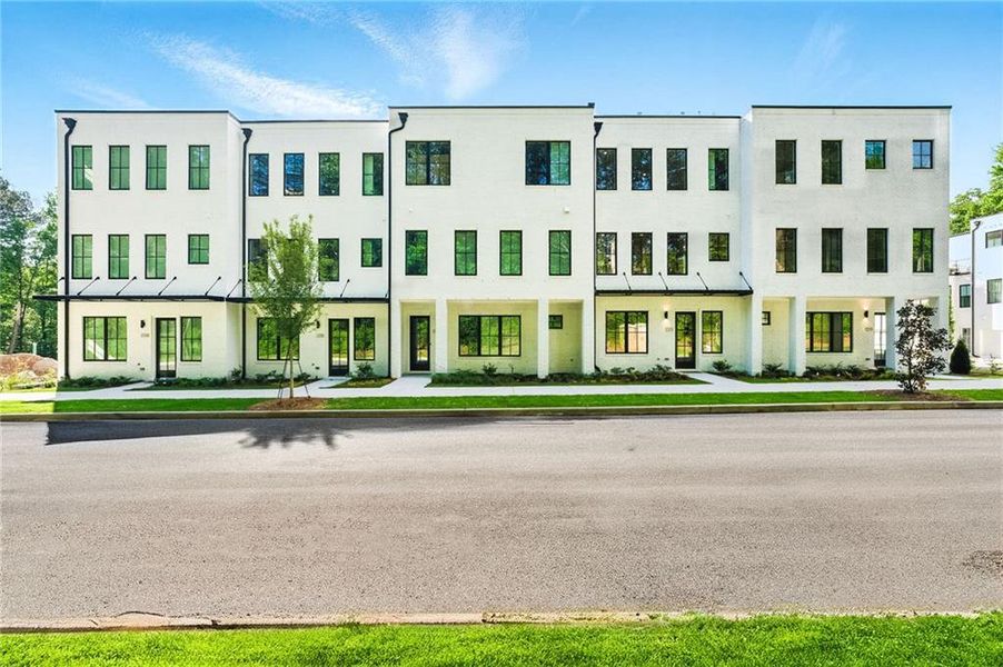 Front exterior of a new home in , Atlanta, GA, highlighting curb appeal (Image 1).