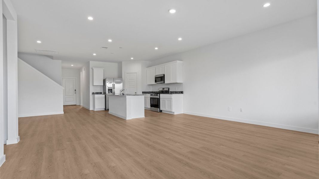 Representative unfurnished interior of a home built from the Mitchell by D.R. Horton in Caldwell Crossing, Iowa Colony (Image 17).