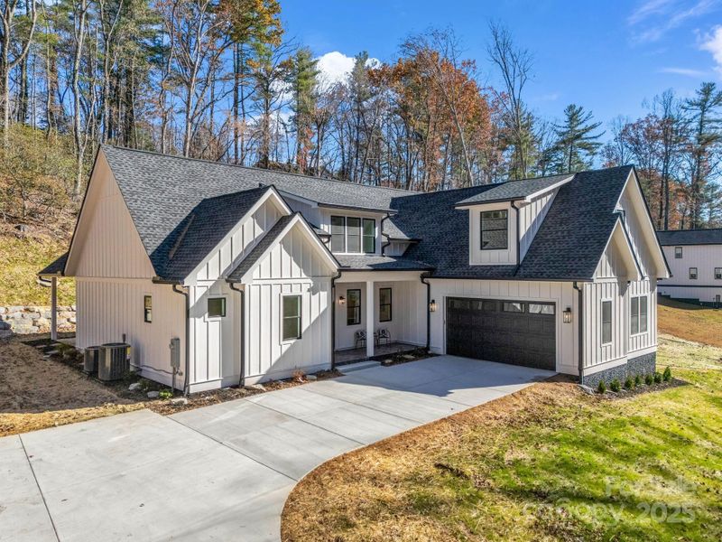 Front exterior of a new home in , Hendersonville, NC, highlighting curb appeal (Image 26).