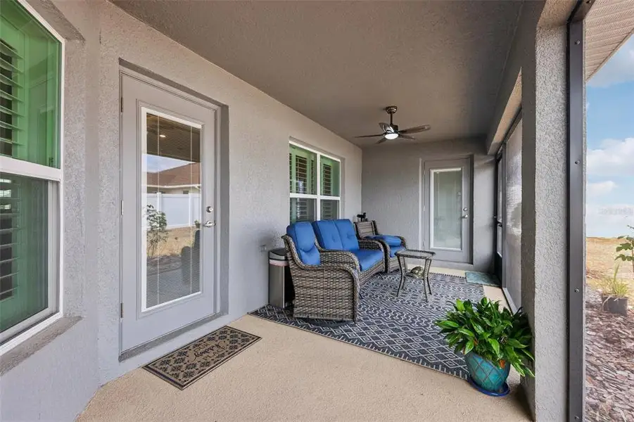 Exterior details and patio area of a home in Oaks at Ocala Crossings, Ocala (Image 4).