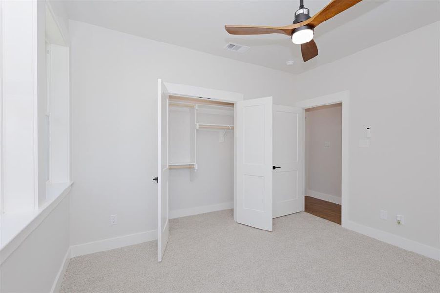Guest Bedroom 2 full size closet with shelving. Guest Bedroom 2 full size closet with shelving.