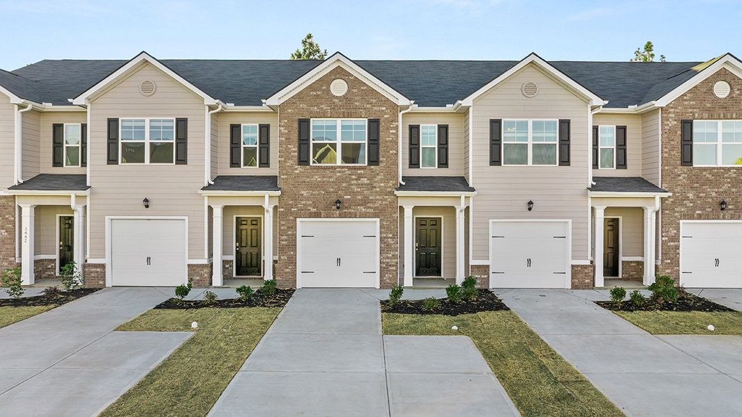 Front exterior of a new home in Laurel Park Townhomes, Hephzibah, GA, highlighting curb appeal (Image 1). Front exterior of a new home in Laurel Park Townhomes, Hephzibah, GA, highlighting curb appeal (Image 1).