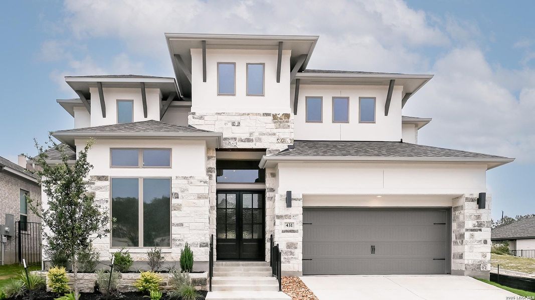 Front exterior of a new home in Hidden Canyon, San Antonio, TX, highlighting curb appeal (Image 17).