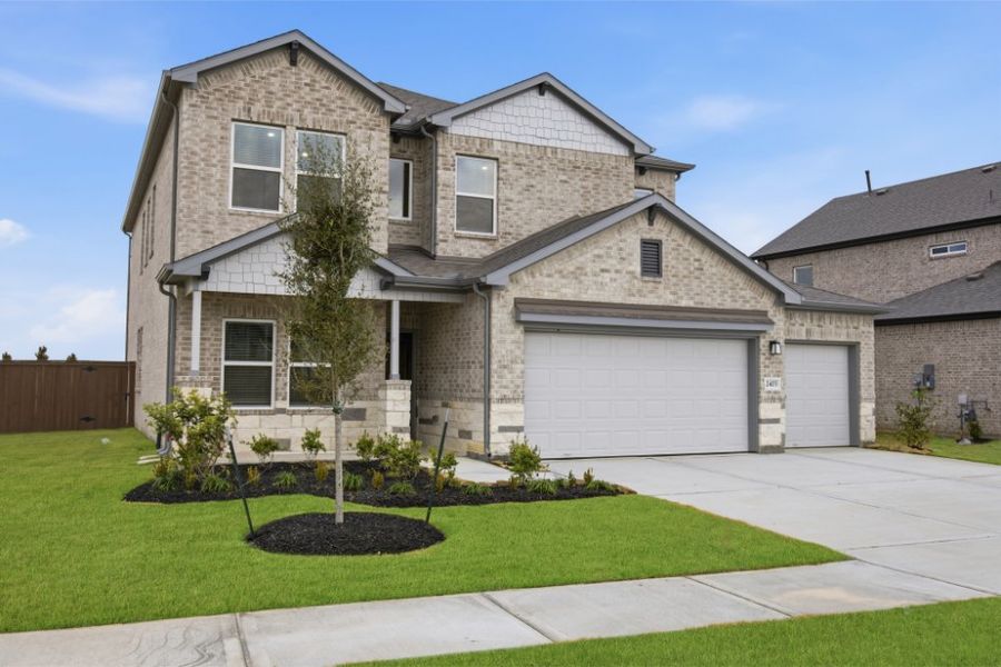 Front exterior of a new home in Creekhaven, Iowa Colony, TX, highlighting curb appeal (Image 20).