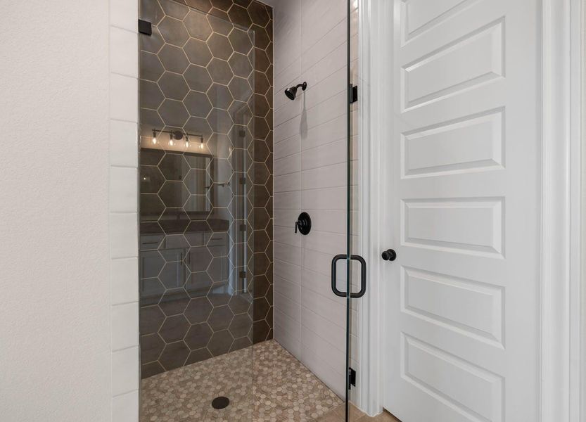 Bathroom featuring a shower stall Bathroom featuring a shower stall