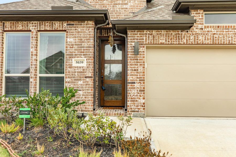 Beautiful front wooden and glass door, showcasing a warm welcome with its elegant design and inviting ambiance. Beautiful front wooden and glass door, showcasing a warm welcome with its elegant design and inviting ambiance.