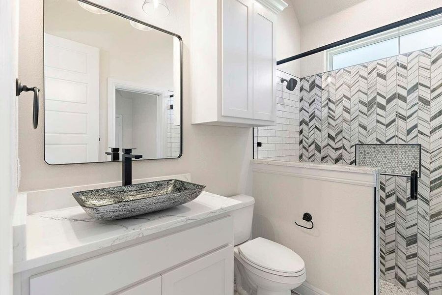 Bathroom with a walk in shower and vanity