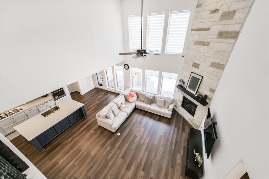 A view of the family room as seen from the upstairs hallway. A view of the family room as seen from the upstairs hallway.