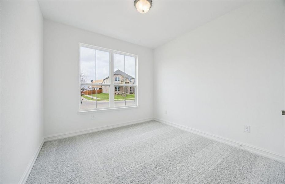 Comfortable bedroom with a bright window view Comfortable bedroom with a bright window view